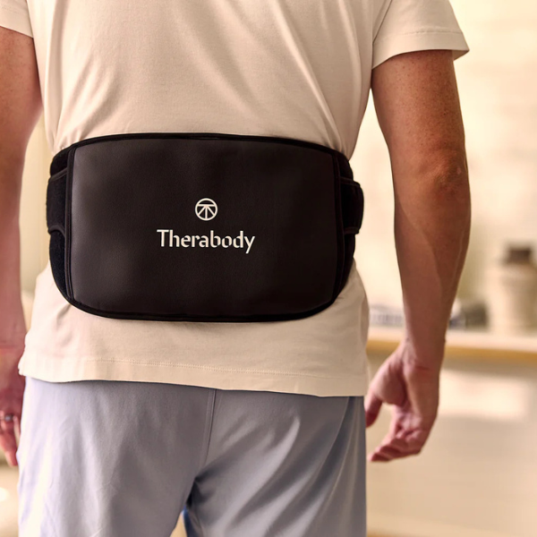 therabody-thermback-LED-back-4in1-multi-modal-synergistic-back-pain-relief-man-student-carrying-books-back-view-rivete-advanced-recovery-and-mobility